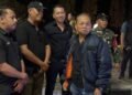 Kasatpol PP Provinsi Bali I Dewa Nyoman Rai Dharmadi (tengah belakang) saat mengawal Gubernur Bali Wayan Koster. -BALITOPIK.COM